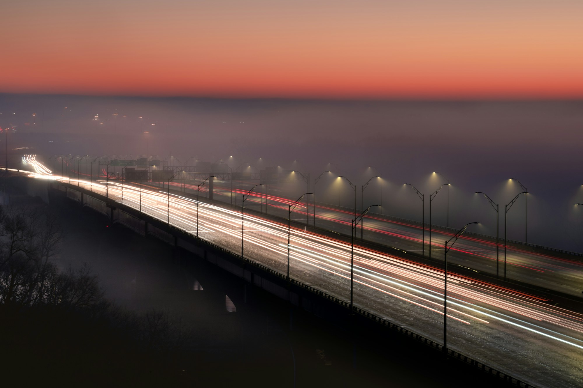 Light trails along a bridge approach into St. Louis.