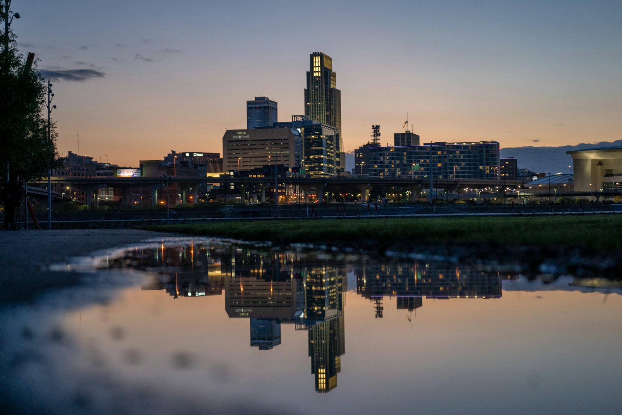 The St. Louis skyline reflected in the river at dusk.