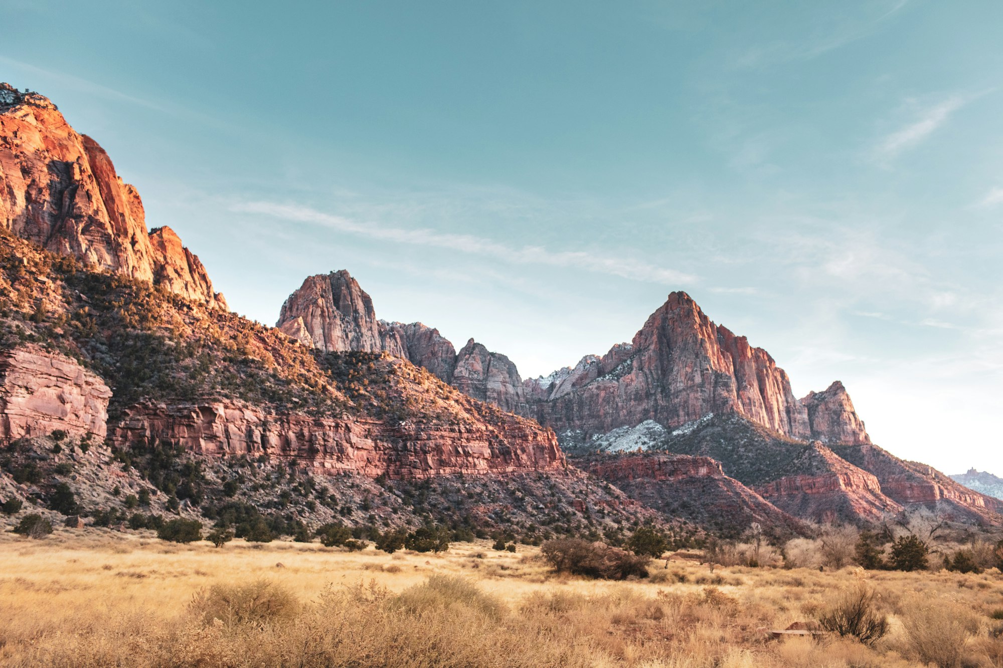 Red rock peaks under a clear sky in Zion National Park.