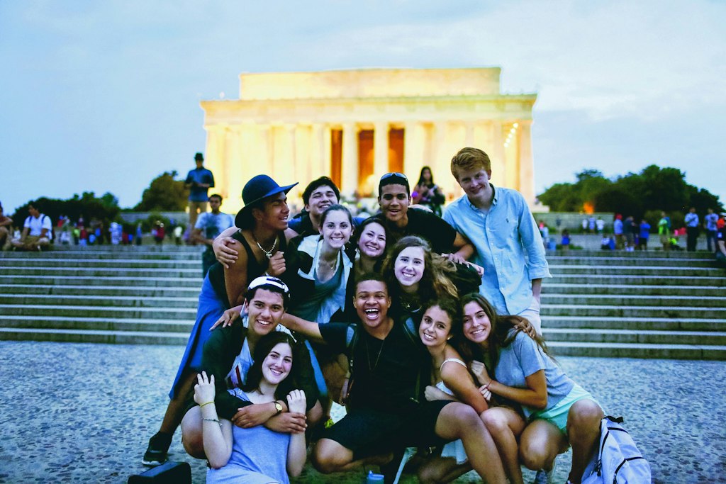 Group of students smiling together during a teen volunteer abroad program focused on leadership and cultural exchange.