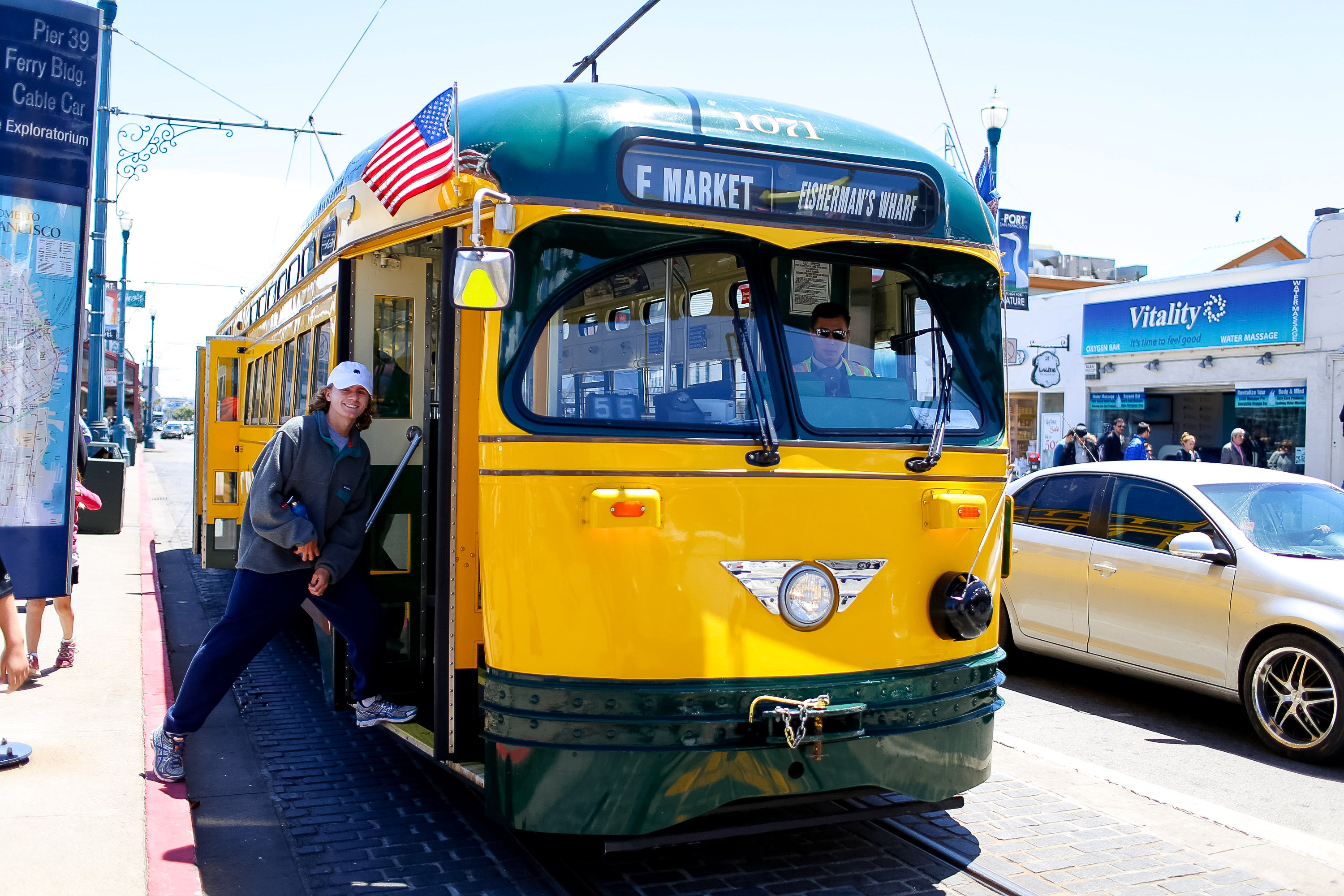 Student travelers step aboard a historic F Market streetcar in San Francisco