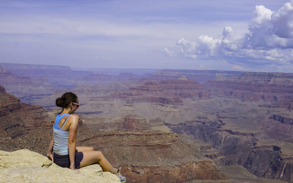 A student looks across the Grand Canyon’s layered rock walls.