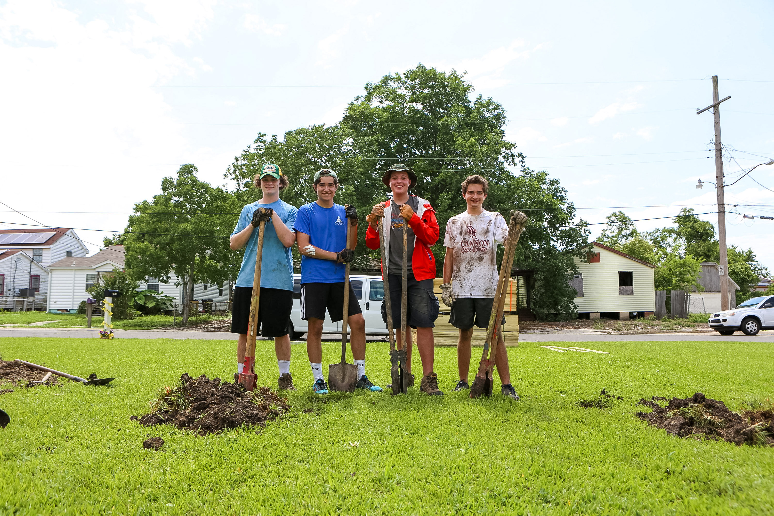 Students holding shovels in New Orleans during service project.