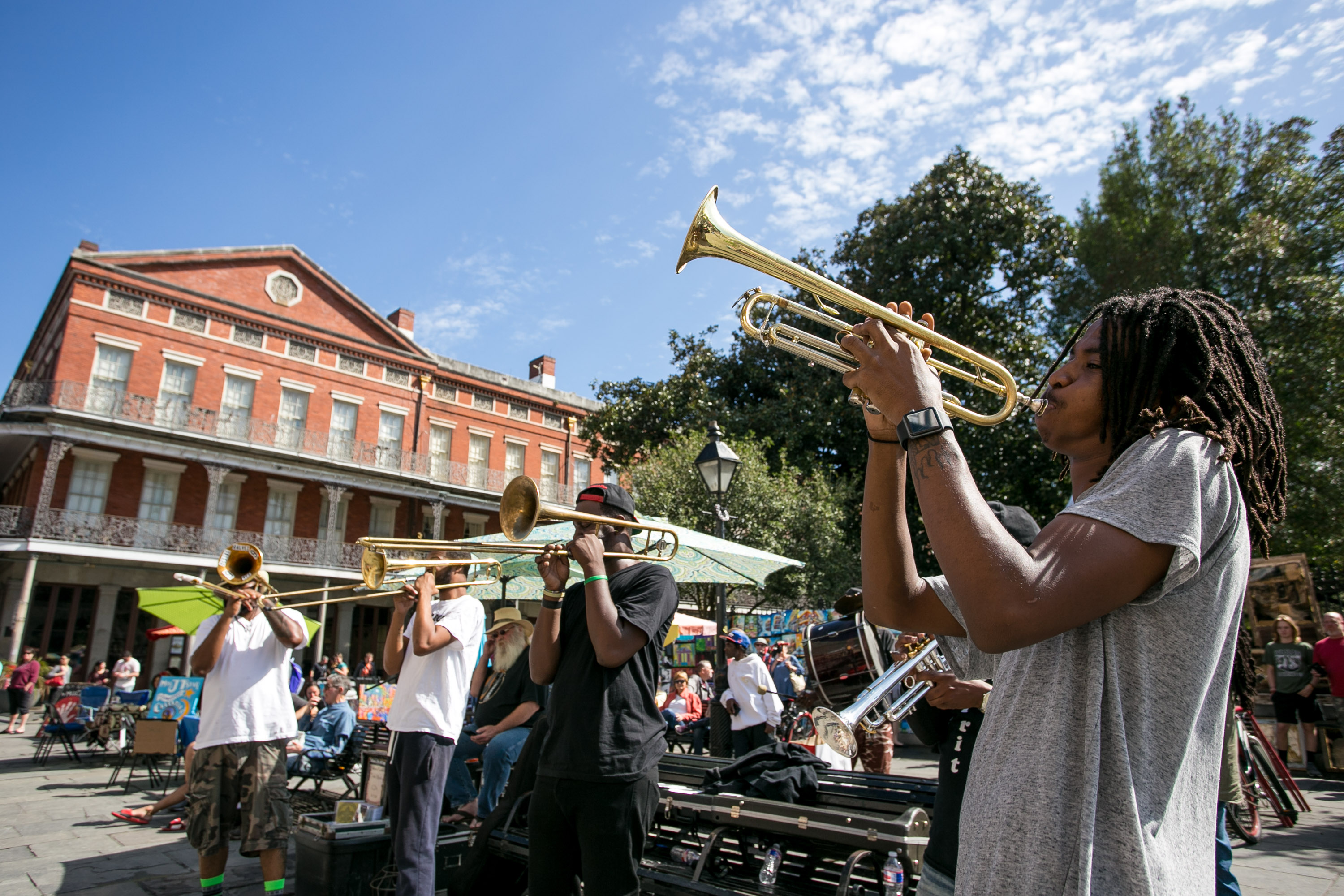 Group of people playing instruments in public in New Orleans.