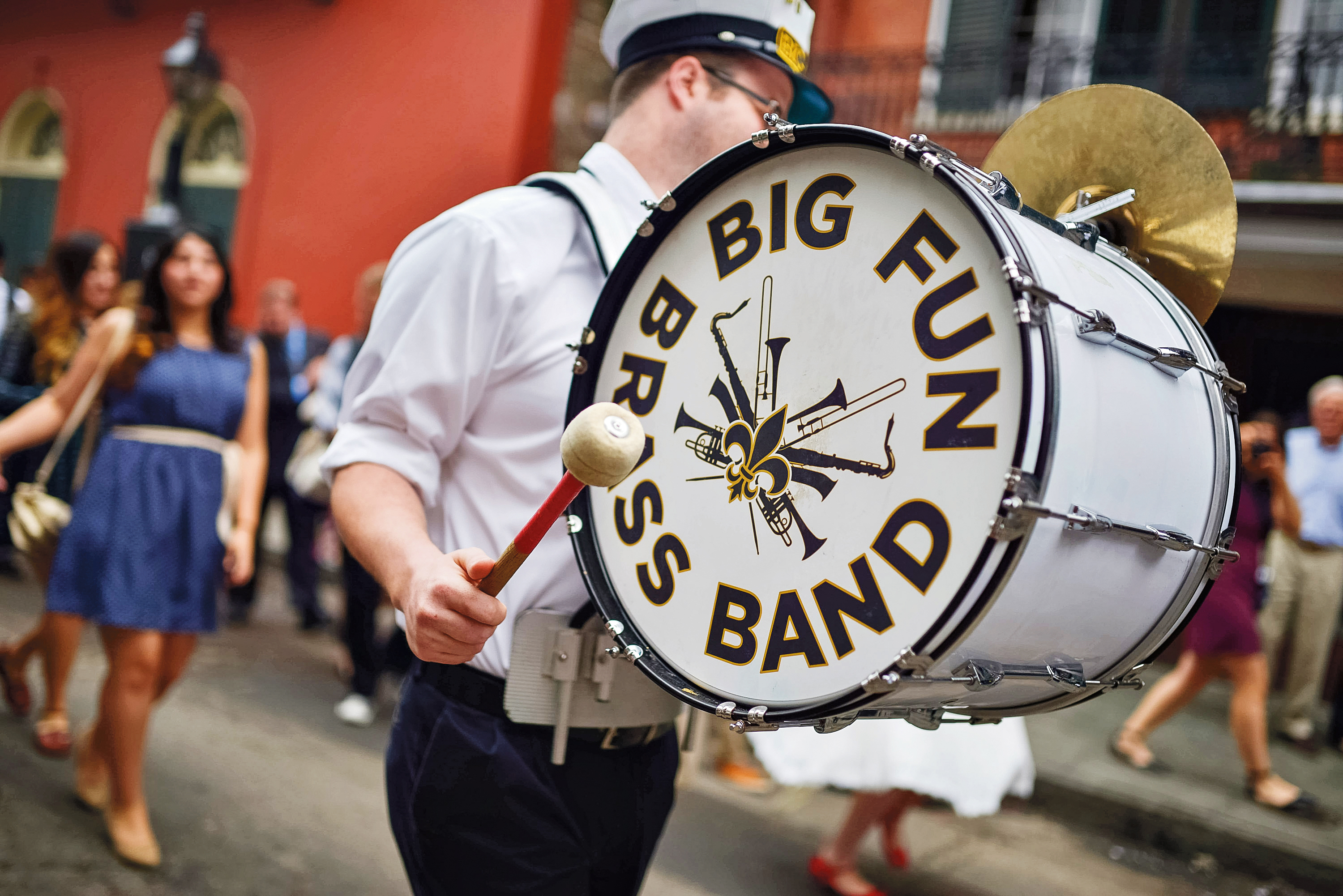 Man playing drum during parade in New Orleans.