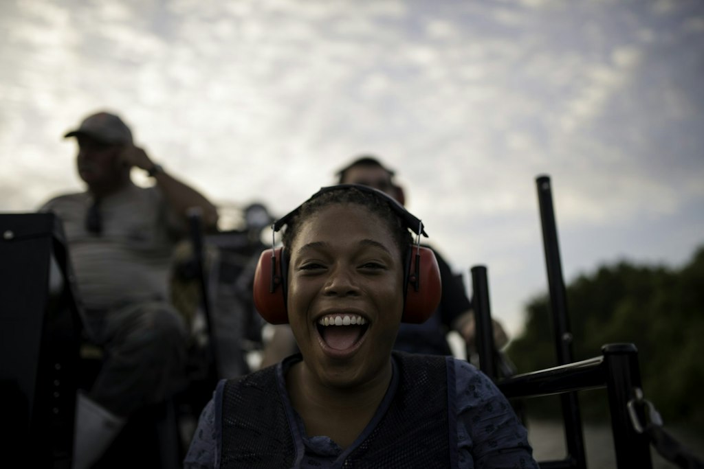 High school volunteer abroad participant smiling during a cultural adventure activity on an international volunteer trip.
