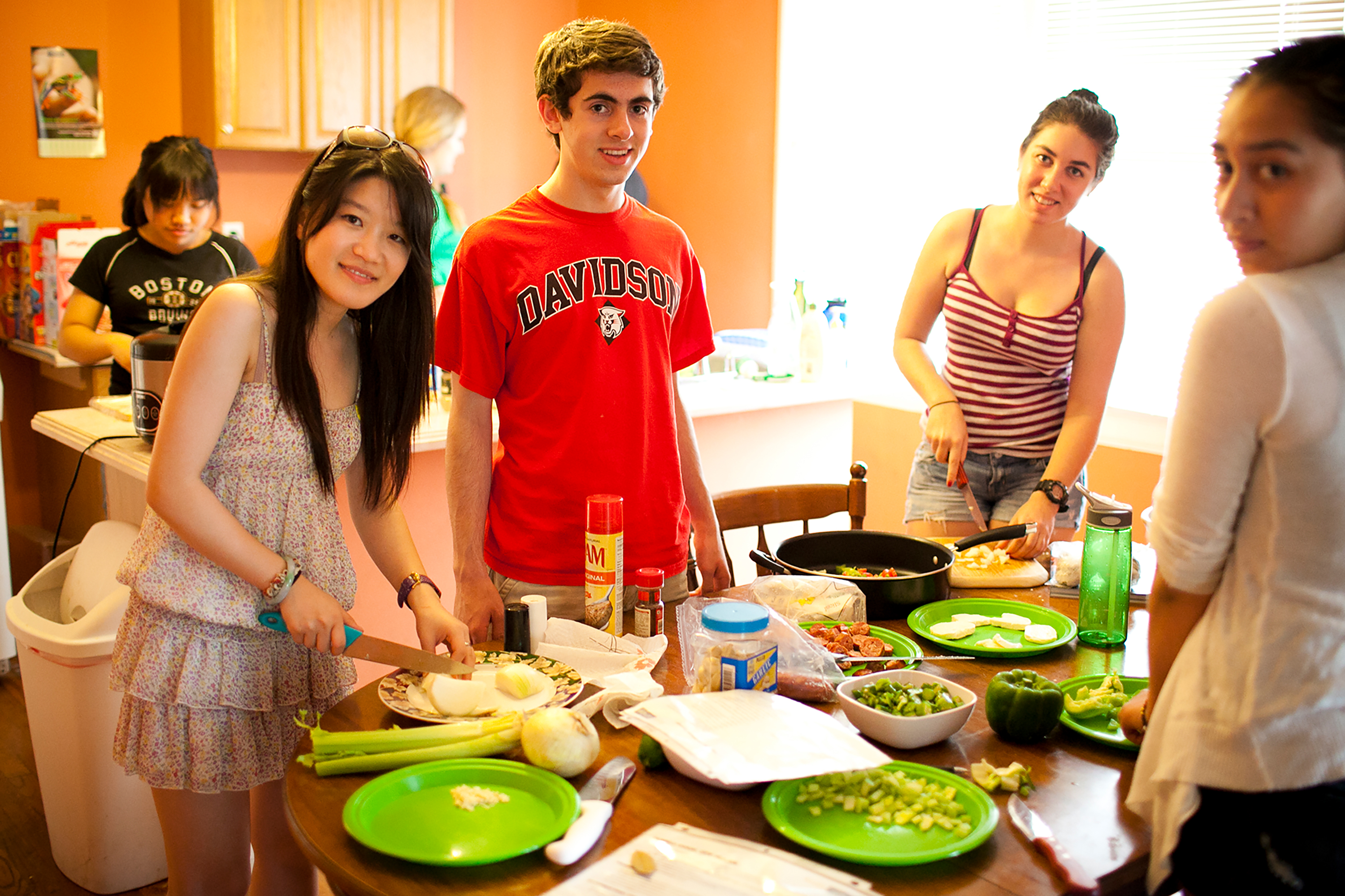 Students preparing food together in a kitchen.
