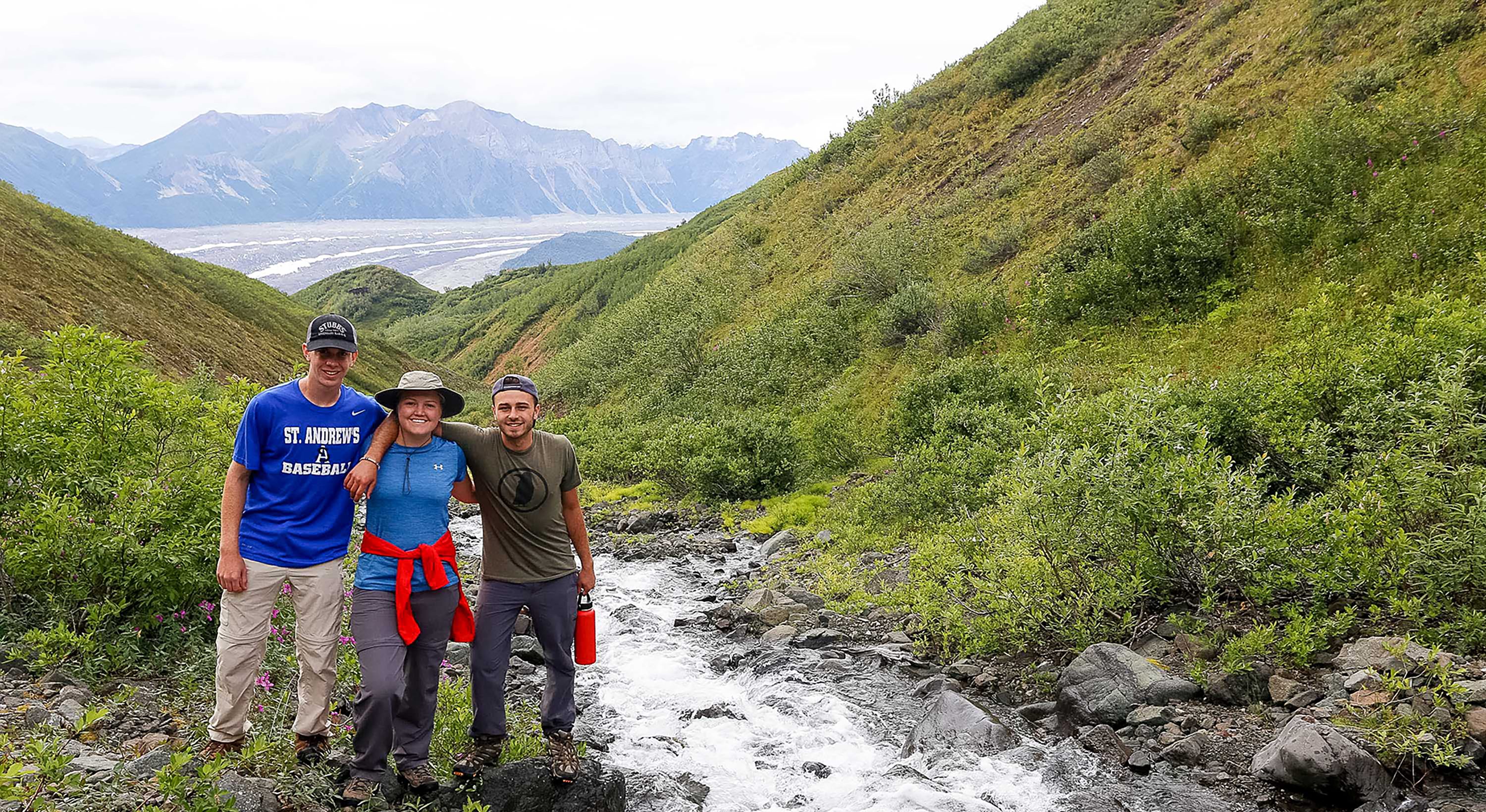 safety and supervision: Program leader and a student pose on a hike