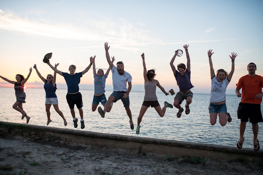 Rustic Pathways Team USA jumping in the air. Find the right camp counselor job.