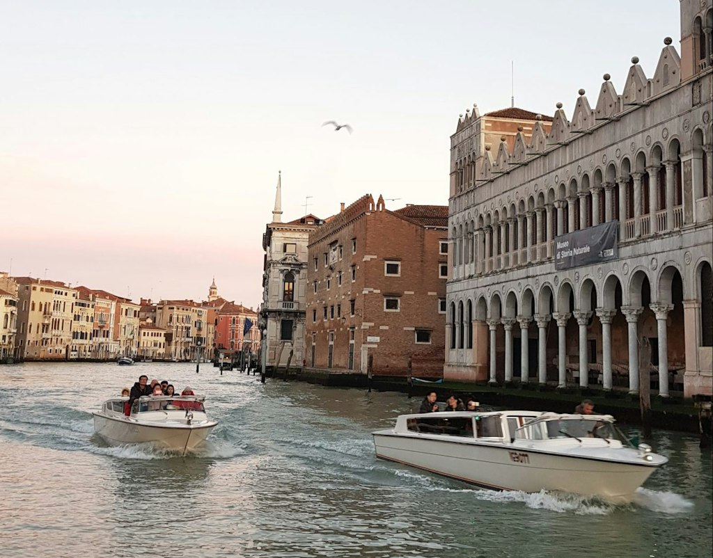 A shot of boats on a canal in Venice.