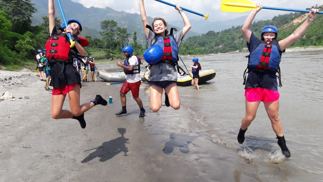 Rustic Pathways students gather finished a water activity.