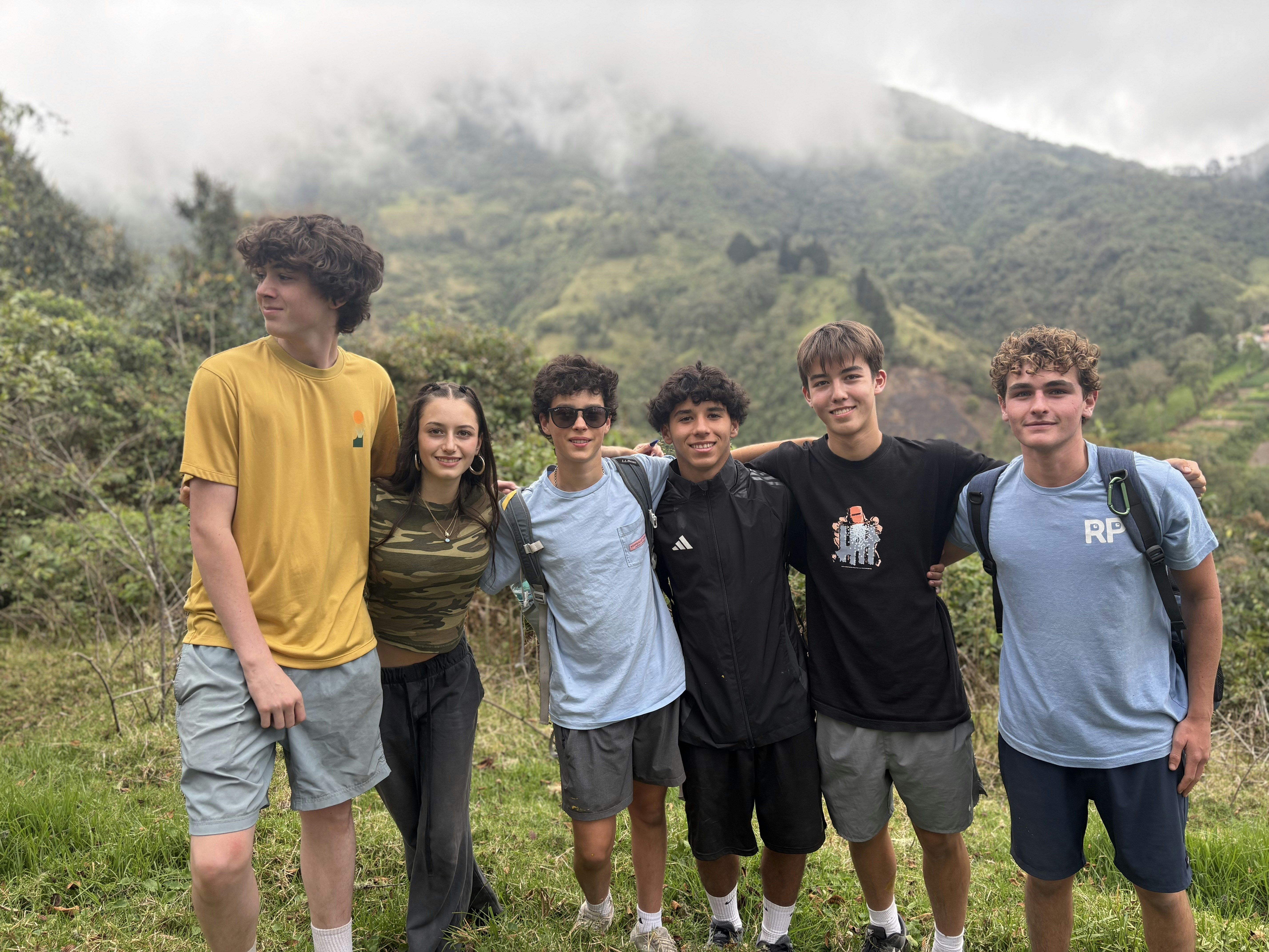 2025 Wild Galápagos students standing together on a mountainside in Yunguilla, Ecuador