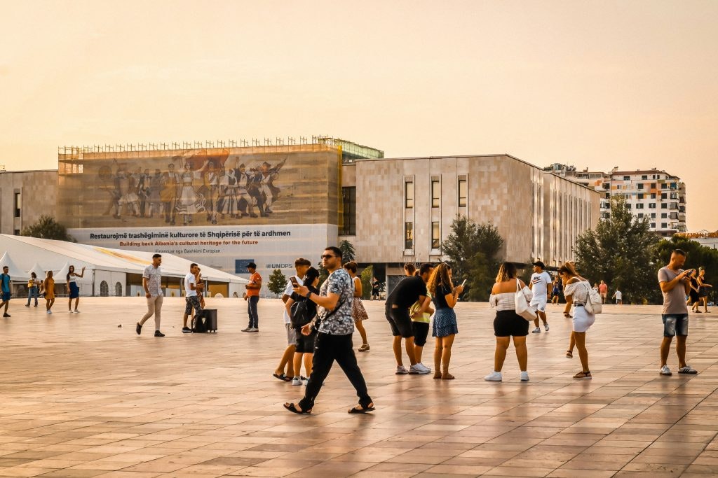 People go for a walk in Tirana, Albania.