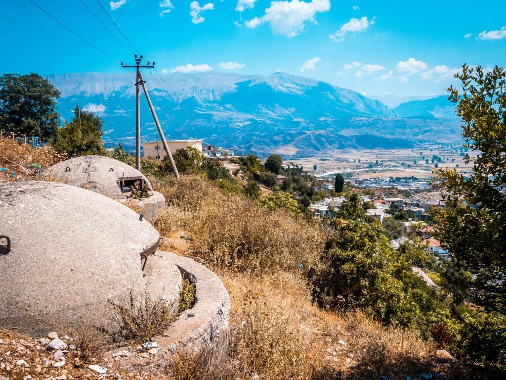 Concrete bunkers overlook the landscape of Gjirokaster, Albania.
