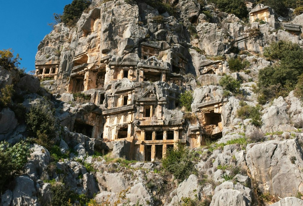 Structures are carved into the cliffside in Antalya Turkey.