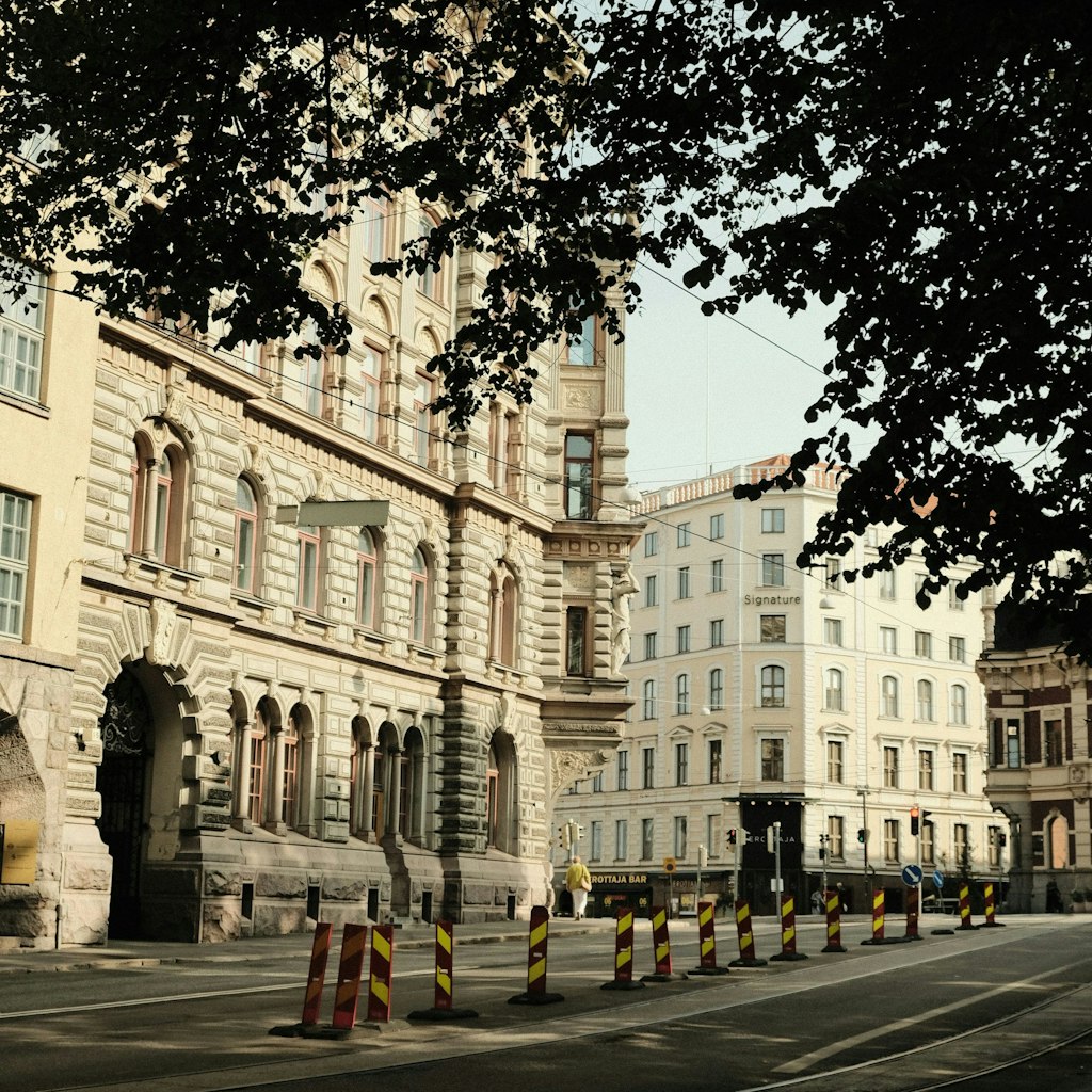 A street in Helsinki featuring white buildings.