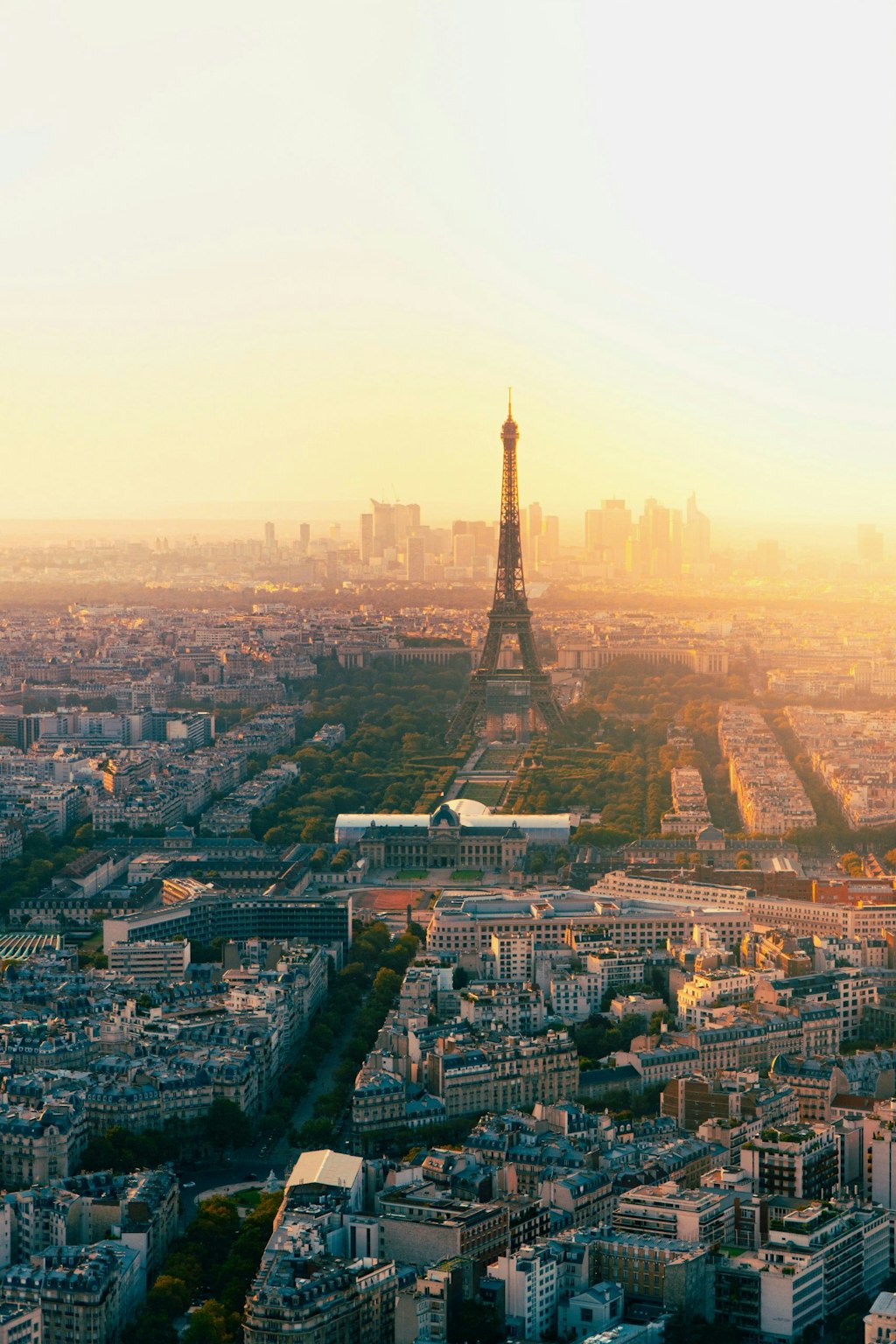The streets of Paris glow in the warm sunset, casting a magical light on charming buildings and cobblestone paths.