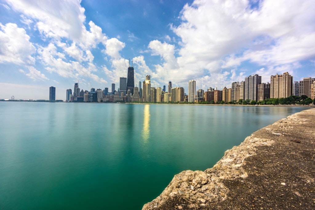 A view of North Avenue Beach with downtown Chicago's skyline in the distance.