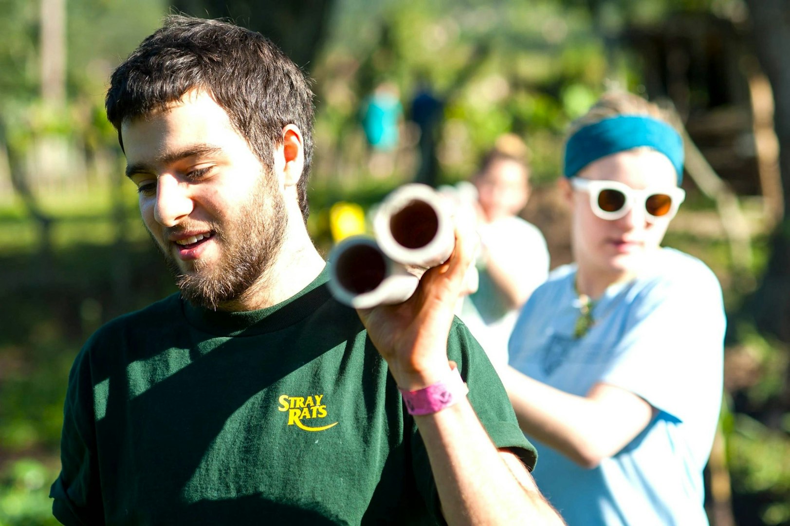 Young traveler volunteering during a gap year, carrying materials for a community service project — one of the best gap year countries for meaningful travel.