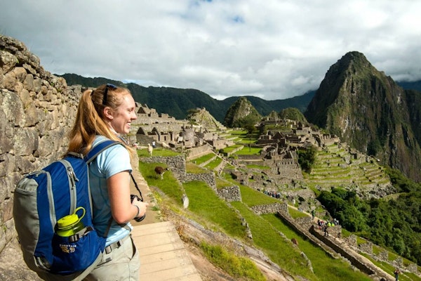 Student traveler exploring Machu Picchu, Peru, during a college travel program with Rustic Pathways.