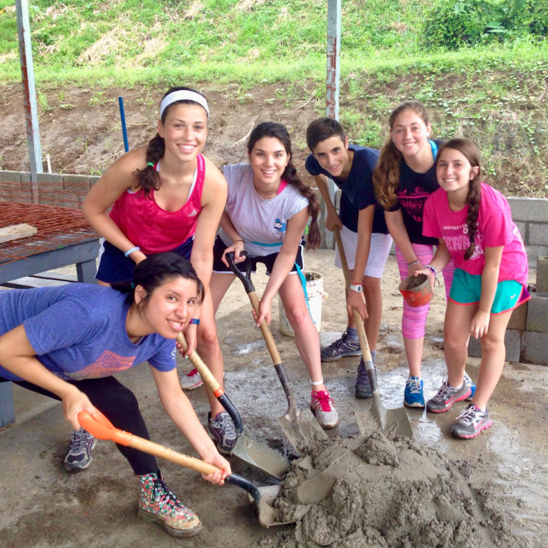 best service trips for teens five girls and one guy shoveling 