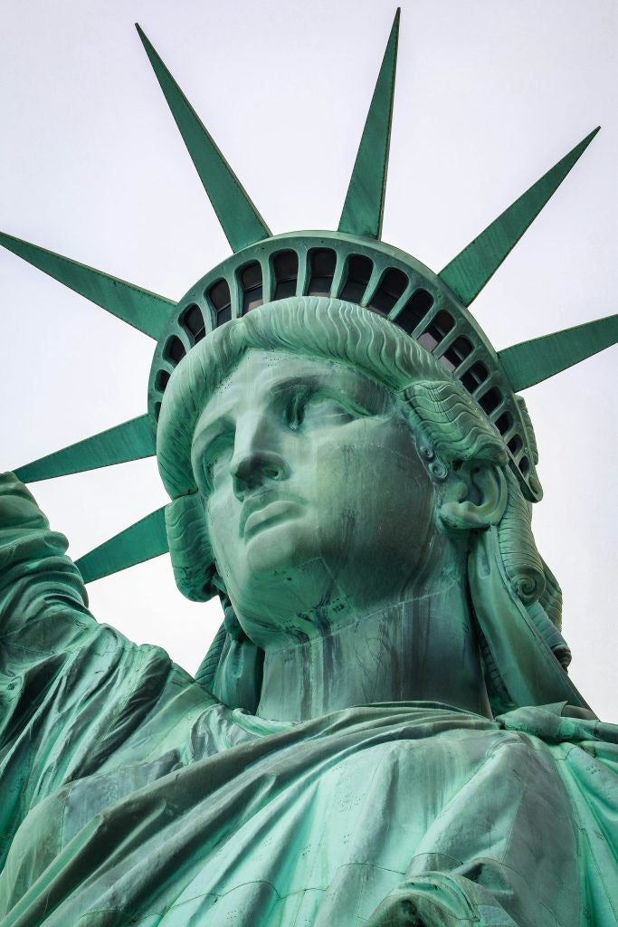 A close-up picture of the face of the Statue of Liberty.