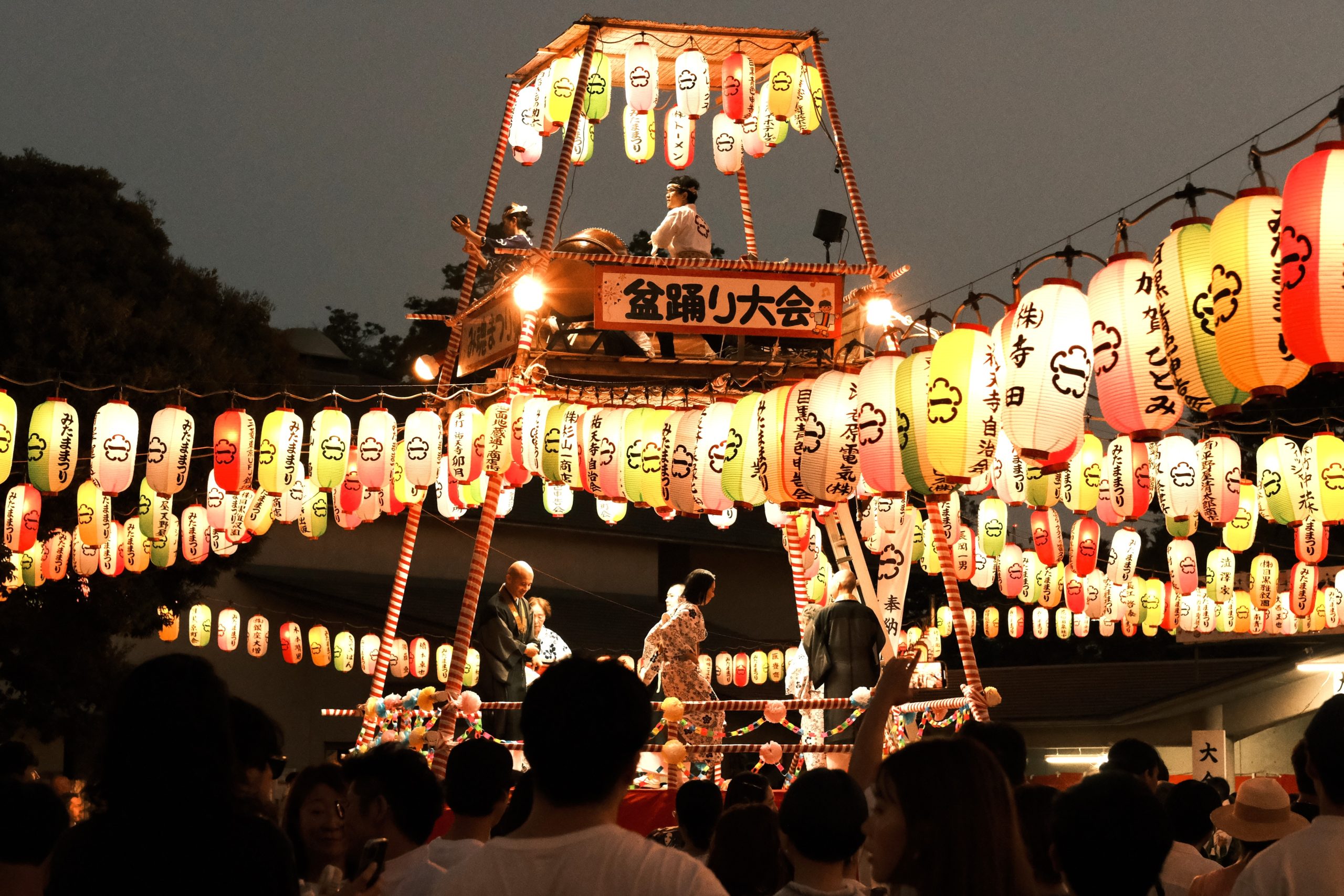 A vibrant Japanese festival with glowing lanterns, showing the cultural immersion benefits of choosing teen travel for global exploration.