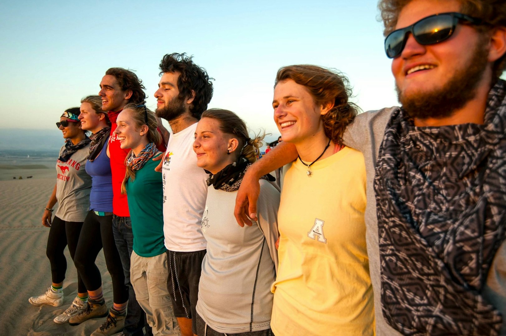 Students on a gap year college deferral enjoying desert adventures with new friends abroad.