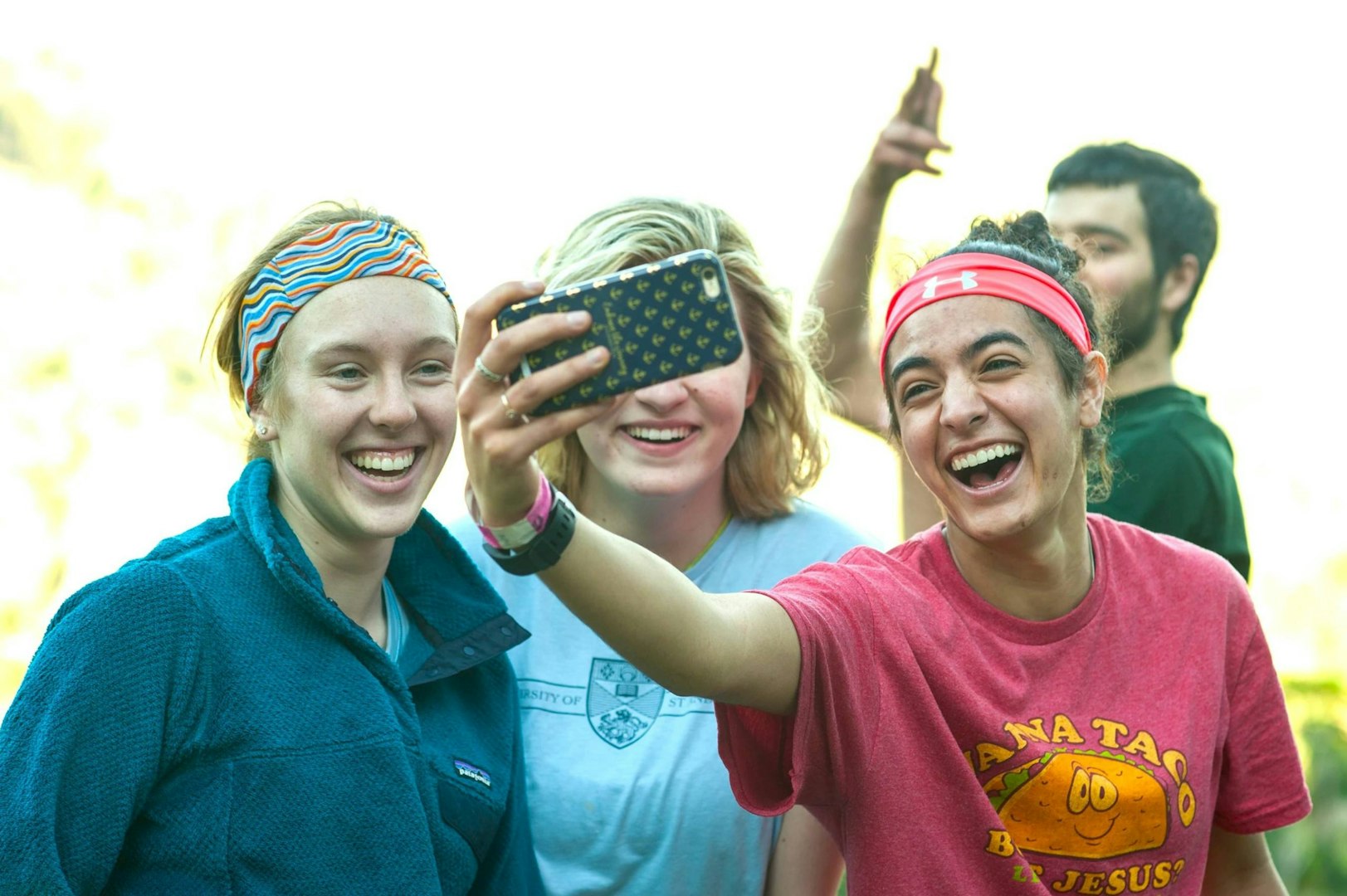 Group of gap year students taking a fun selfie during their travels.