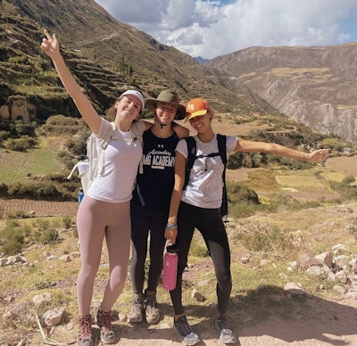 Student travelers hiking in Peruvian mountains during a teen travel program.