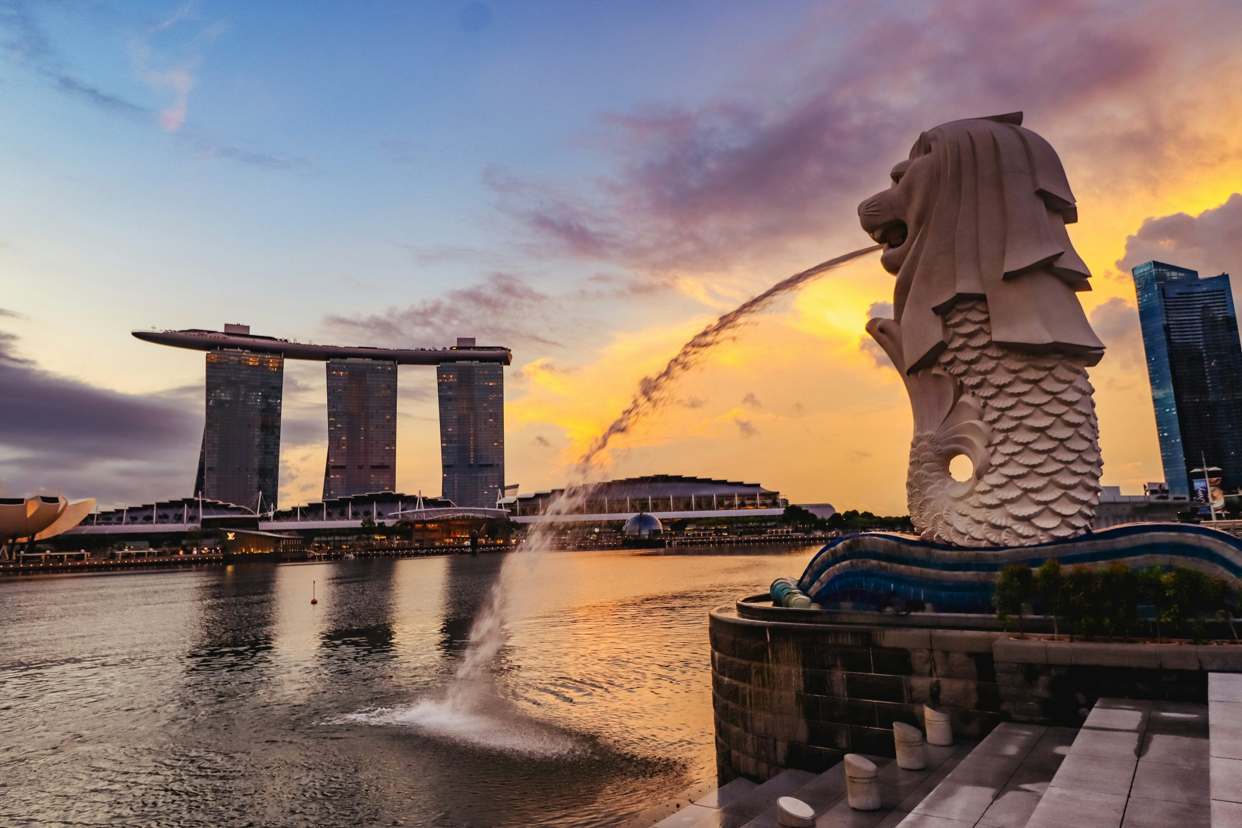 A large fountain in the shape of a lion head spewing water into the air