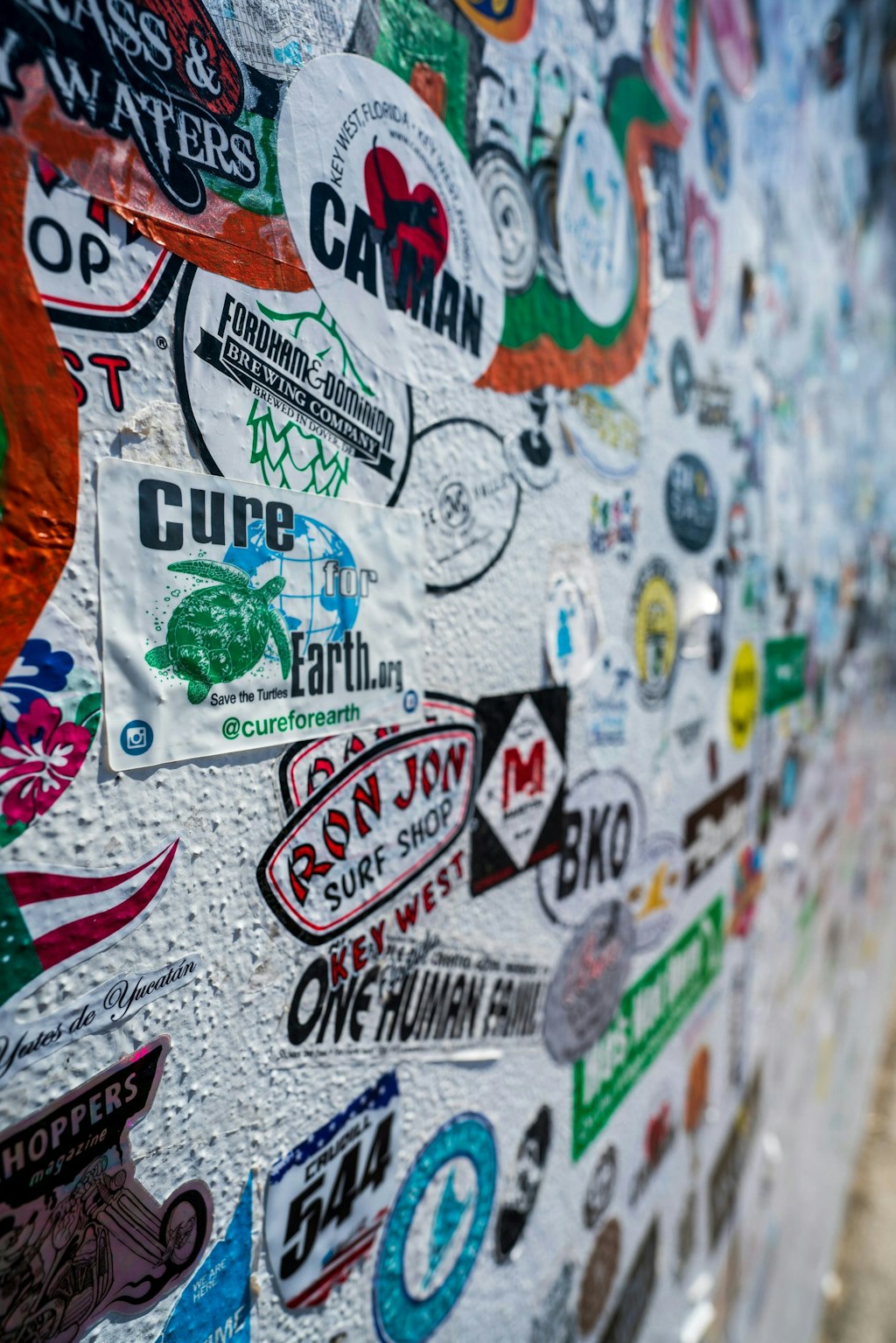 Picture of many stickers placed on a wall in Florida Keys. Key West Fun Facts About Key West