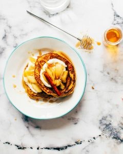 photo of Dutch pancakes from Aruba, topped with fruits and honey