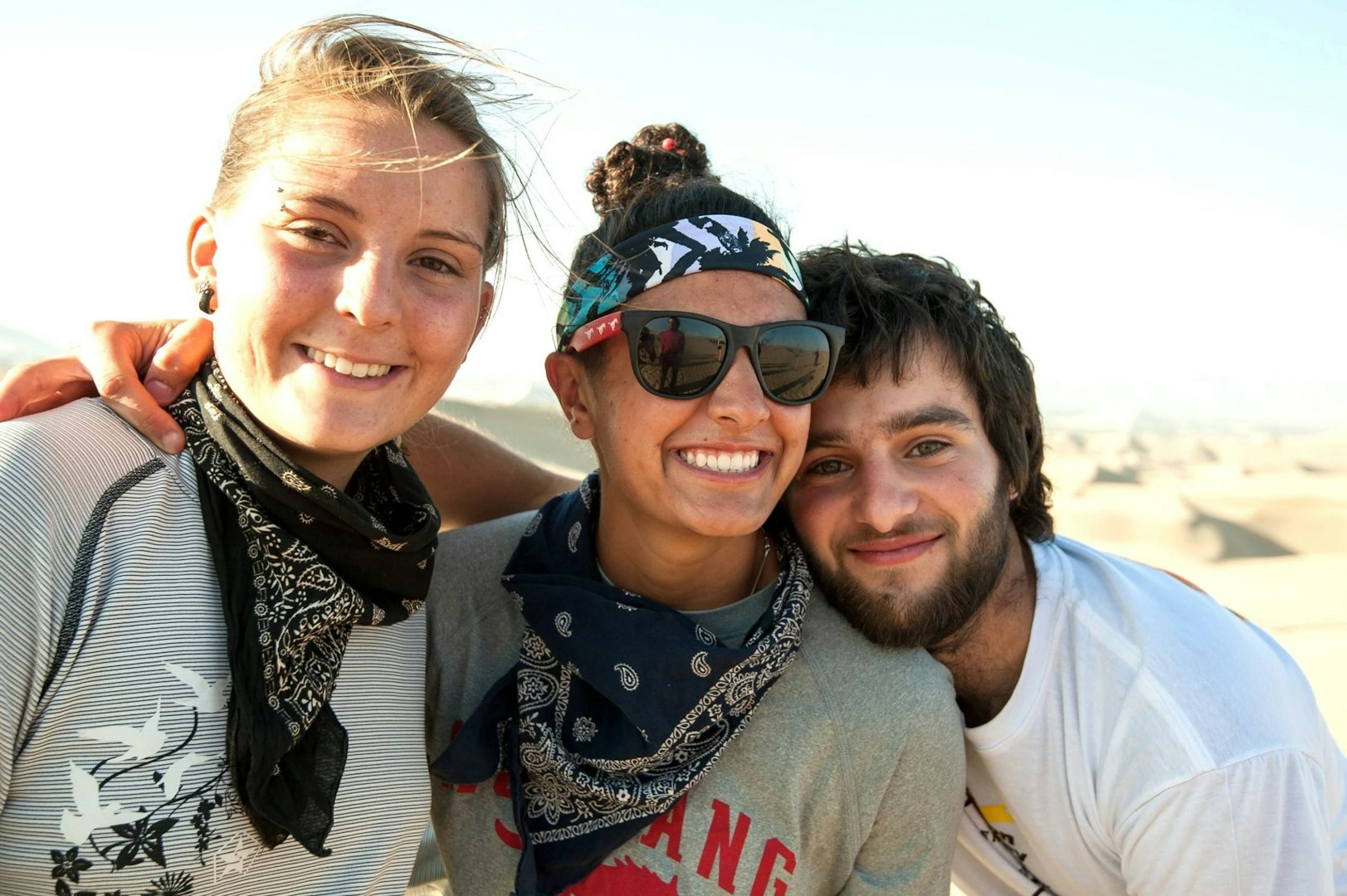 Gap year students enjoying friendship and adventure in the desert.