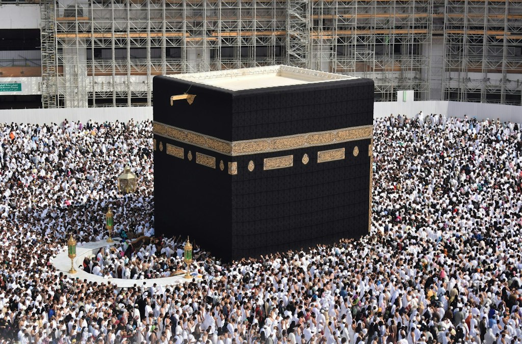The Kaaba stands in the center of the grand mosque. Many people are gathered around it. Learn more fun facts about Makkah.
