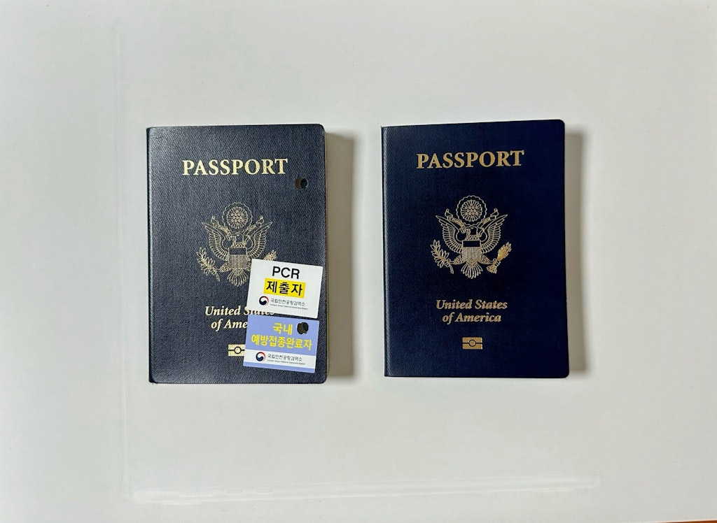 How To plan a teen travel. An older US passport next to a renewed US passport.