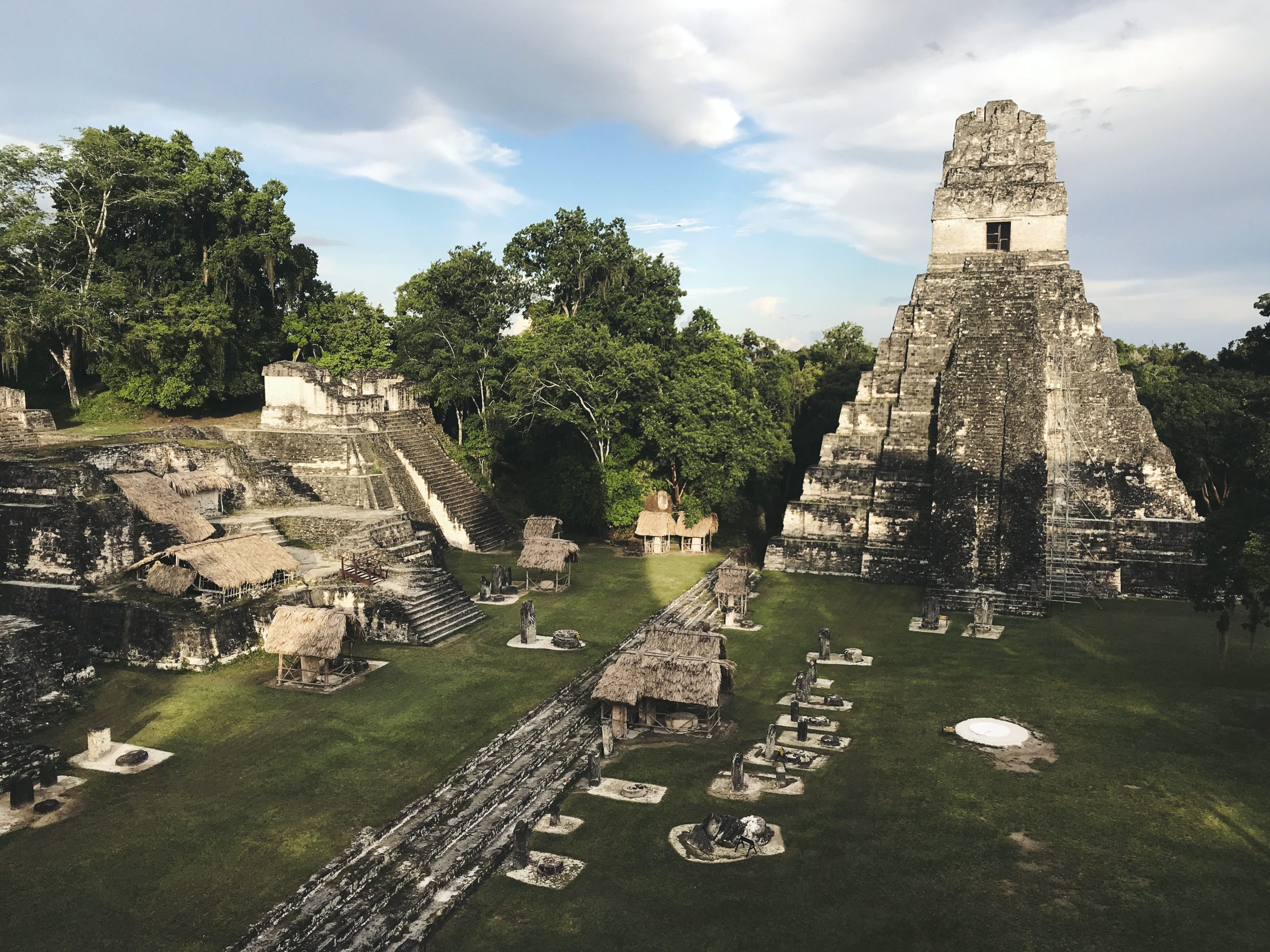 Ancient Mayan temple rises above the jungle canopy at Tikal ruins