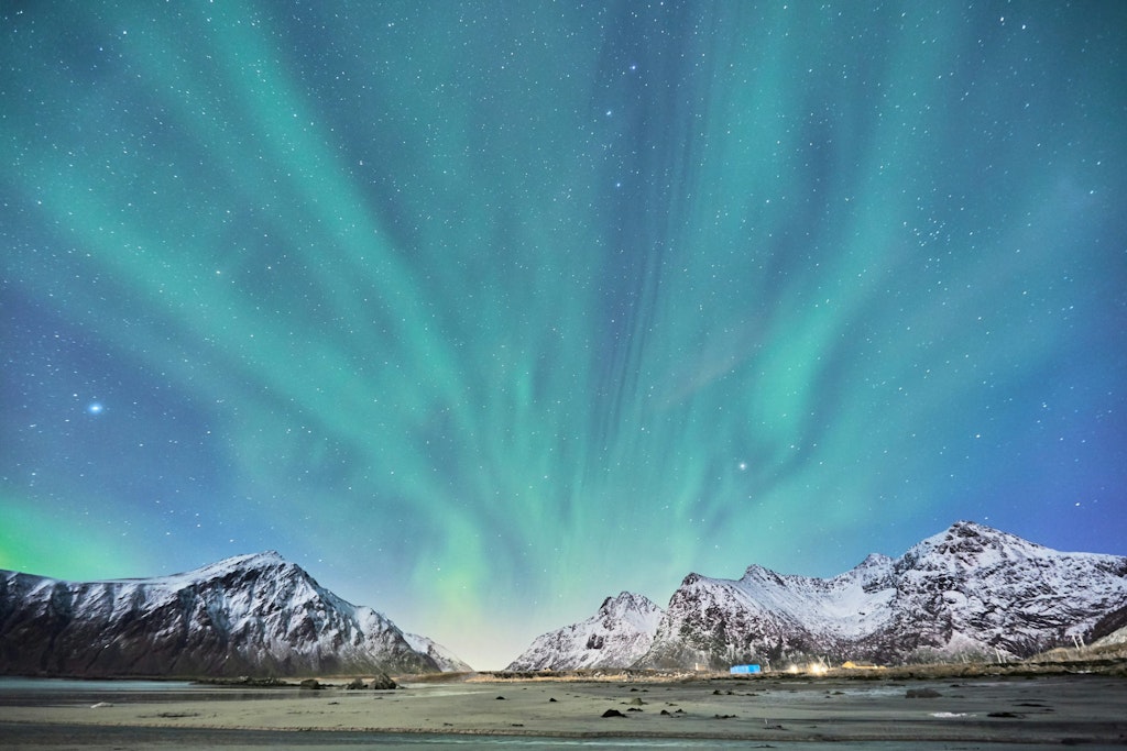 Photo of the green Northern Lights in Lofoten during night time. Norway