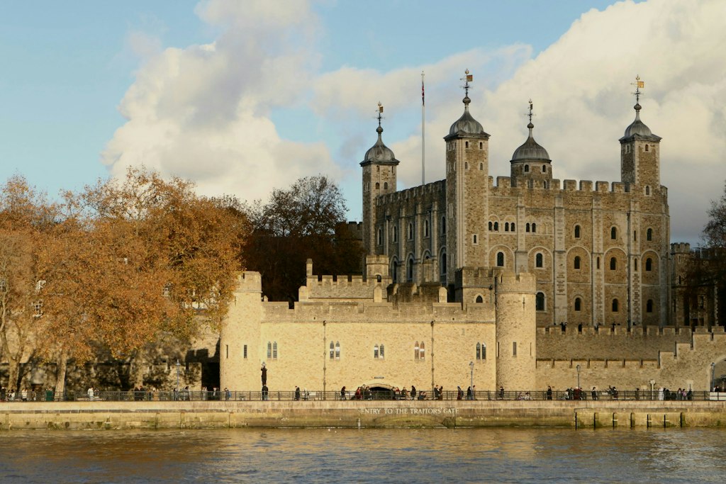 The Tower of London and the entrance to the Traitors' Gate can be seen from across the River Thames.