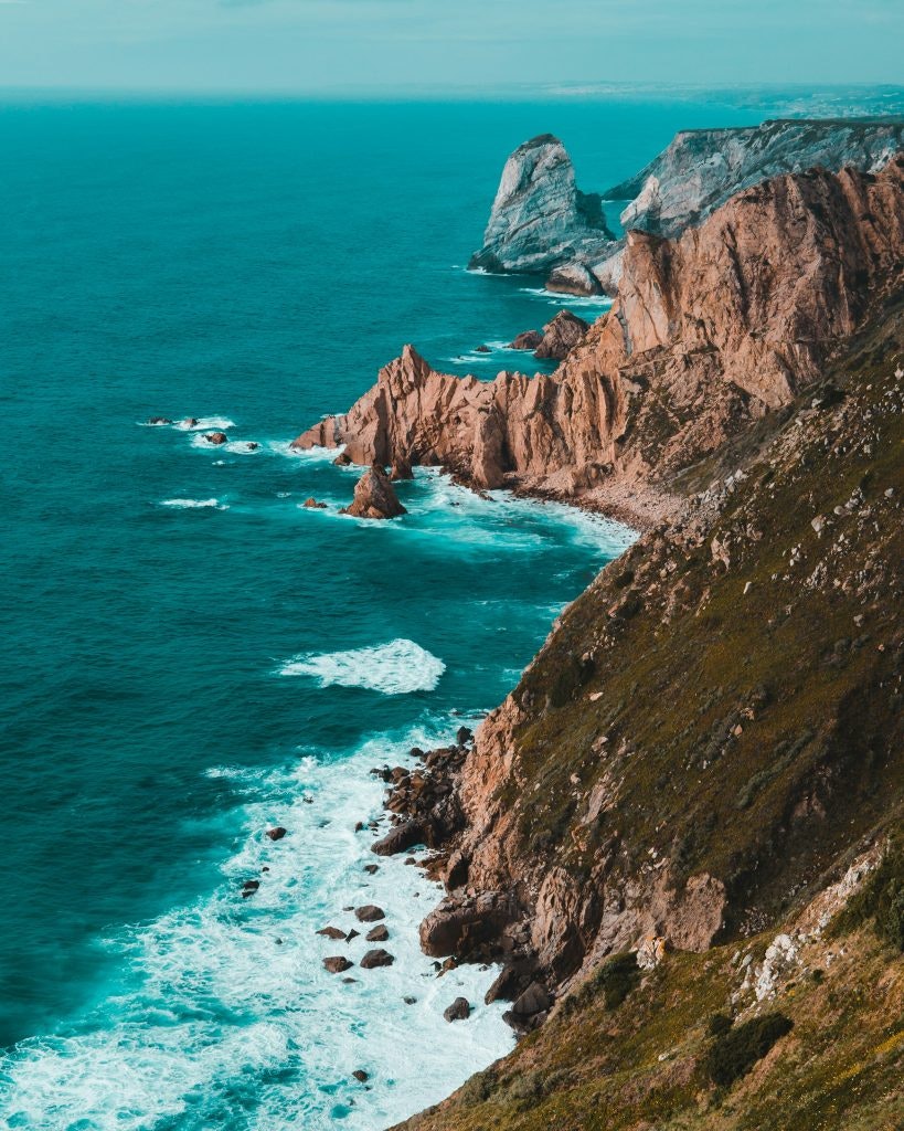 The blue Atlantic ocean meets Portugal's coastal area. fun facts about portugal