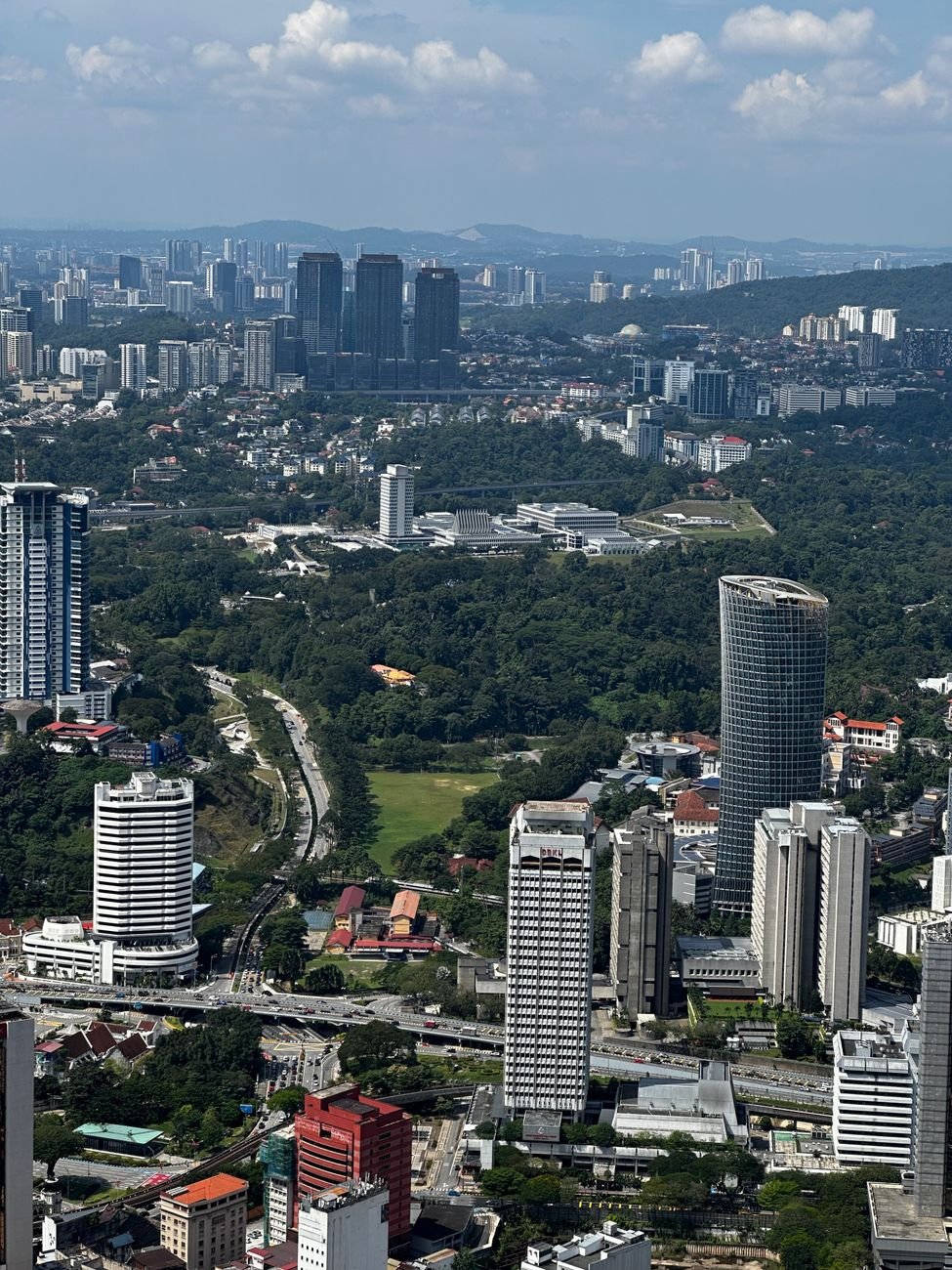 A dense city skyline seen from above on a clear day.