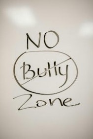 White board written: No bully zone, with bully being marked over