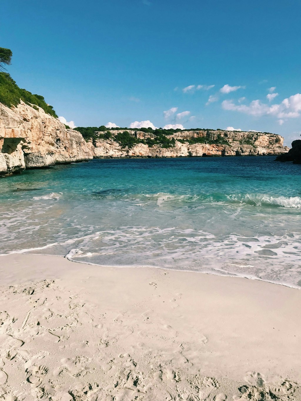 Cristal-clear water and white sand beach in Cap des Moró, Illes Balears in Mallorca, Spain. Fun Facts About Palma de Mallorca