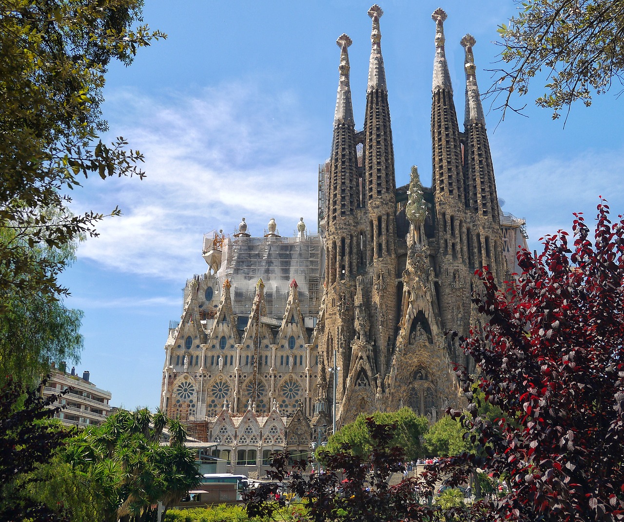 The Sagrada Familia's towers rise above trees in Barcelona