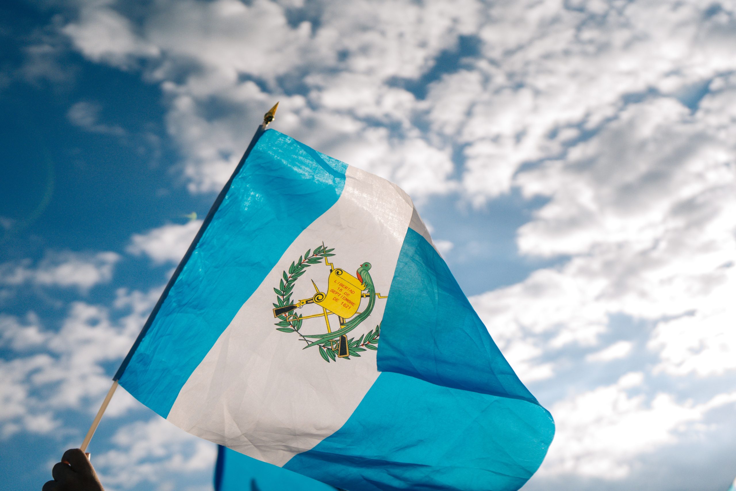 The flag of Guatemala against the sky.