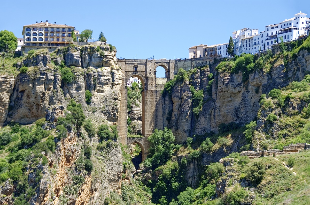 Puente Nuevo bridge spans a deep gorge in Ronda, with whitewashed buildings perched on the cliffs above