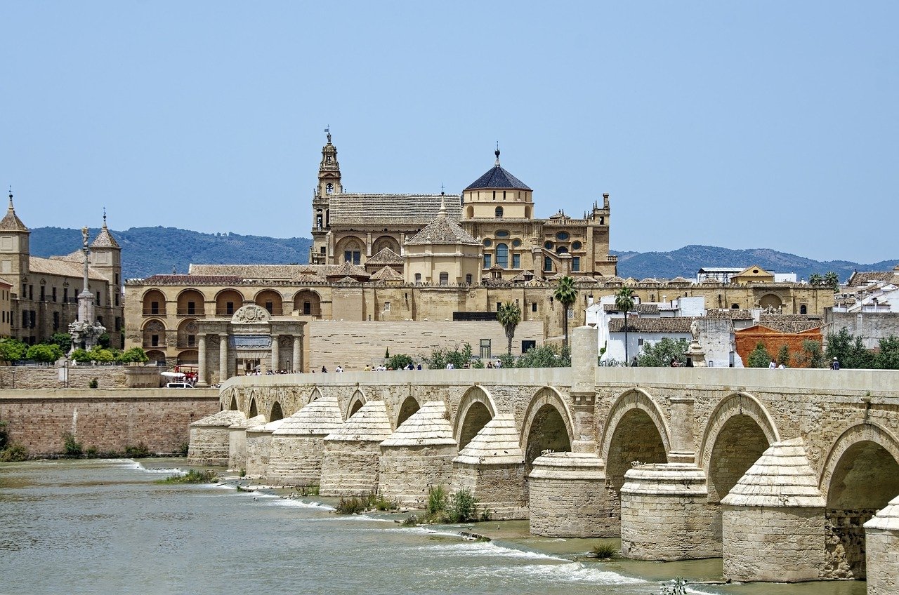 The Roman Bridge arches over the river toward Córdoba's Mezquita-Cathedral