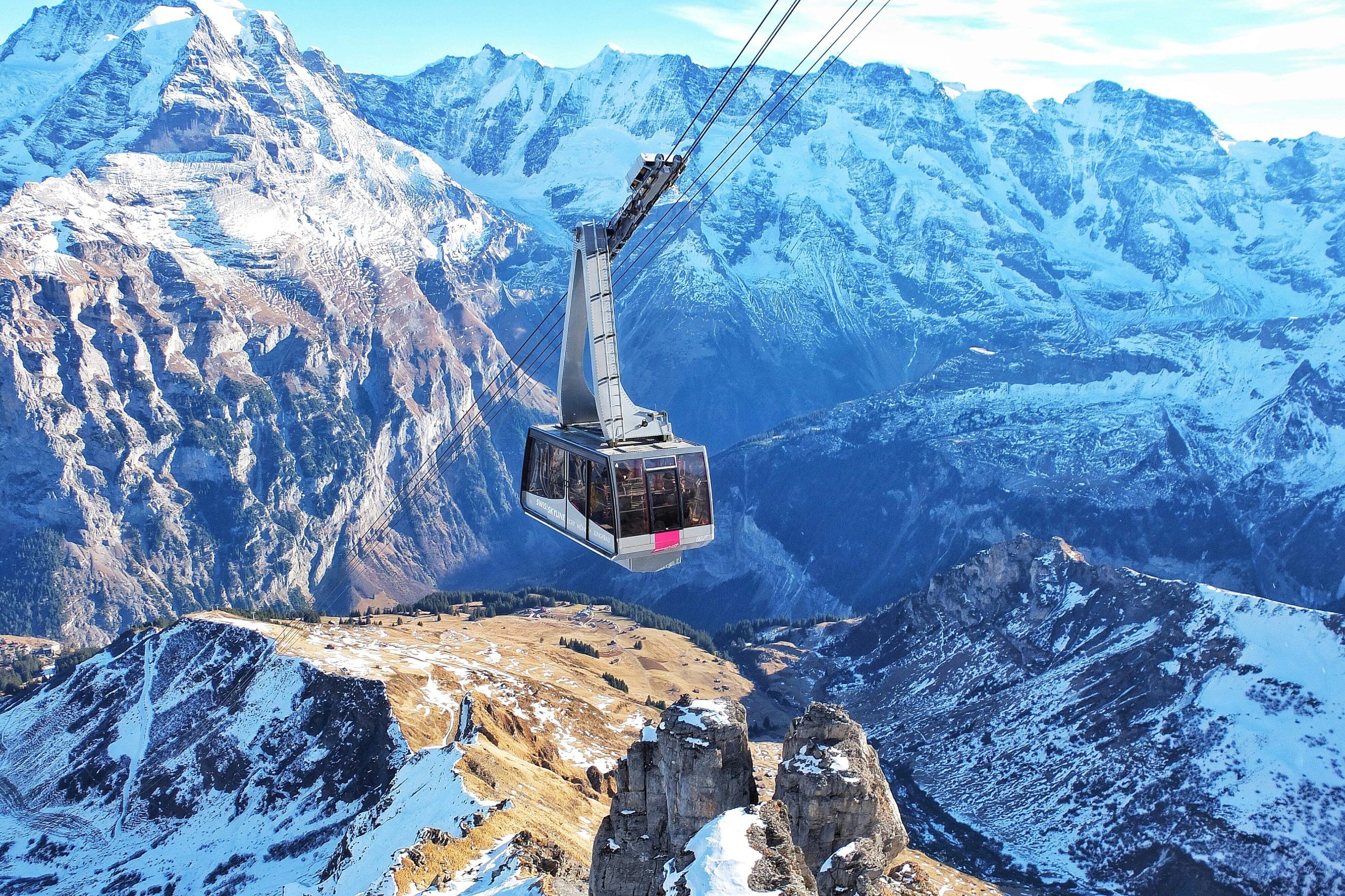 Picture of mountains in Switzerland with cable car traveling.