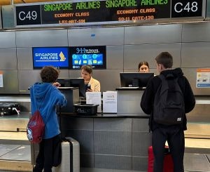 Teen Travel Documents Guide students checking in for their trip at the airport