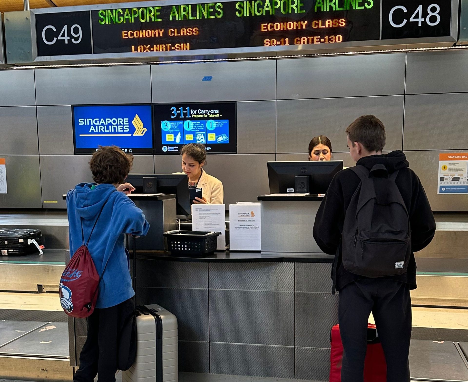 Teen Travel Documents Guide students checking in for their trip at the airport